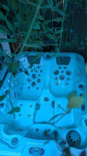 a blue table with many remote controls on it at Eagle Ridge Family Vacation House in General Trias