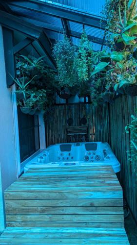 a jacuzzi tub sitting on a wooden deck at Eagle Ridge Family Vacation House in General Trias