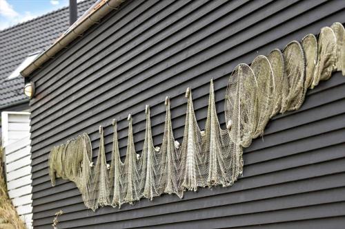 a bunch of netting hanging on the side of a house at 20123-Samso-Maarup-Havn-7-A in Nordby