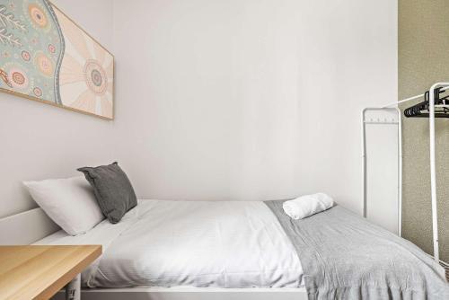a white bedroom with a bed and a desk at Single Room - Private Spot in Kingsford - Convenient Location - Shared Bathroom in Sydney