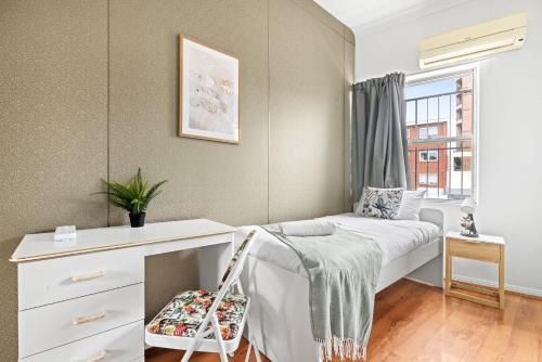a small bedroom with a bed and a dresser at Single Room - Private Spot in Kingsford - Convenient Location - Shared Bathroom in Sydney