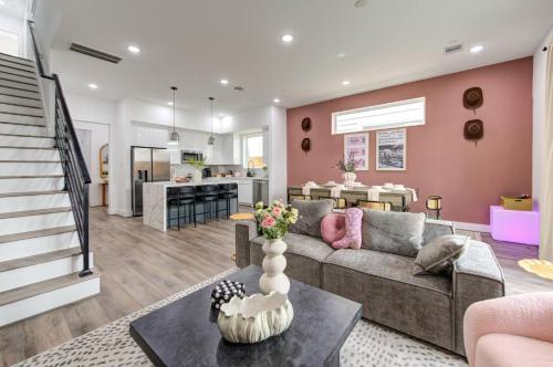 a living room with a couch and a table at HoustonHideaway 3BR/3.5BA near UH BBQ & Pool Table in Houston