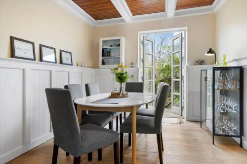 a dining room with a table and chairs at 20329-Samso-Smedegade-8 in Tranebjerg