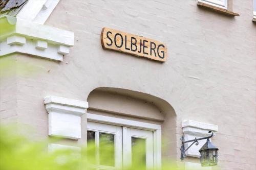 a sign on the side of a building at 20329-Samso-Smedegade-8 in Tranebjerg