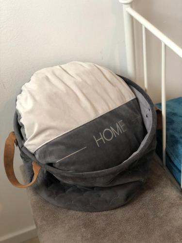 a black and white bag sitting on the stairs at Gemütliches Apartment in bester Lage in Neheim in Arnsberg