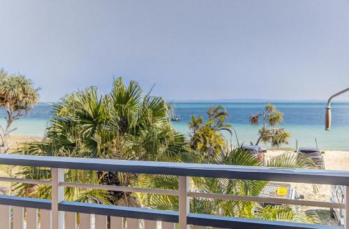a view of the beach from a balcony at Villa 52 Tangalooma in Tangalooma
