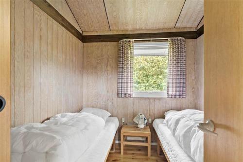 a bedroom with two beds and a window at SB50361-Nordborg-Krabbestien-11 in Nordborg