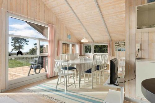 a dining room with a table and chairs at SB113-Sydals-Oddermosen-11 in Sønderby