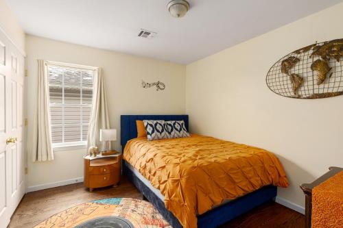 a bedroom with a bed and a window at Newark Gem 6BR, 5BA - Sleeps 24 - Walk to Prudential Center and Newark Penn Station, Near EWR and American Dream Mall, includes Parking - WiFi - Laundry - Backyard - Gym in Newark