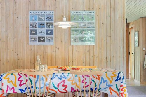 a dining room with a table with a colorful table cloth at TV1586-Jerup-Kuskevej-5 in Jerup