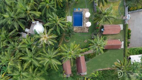 an aerial view of a resort with palm trees at La Royale Nusa Penida in Nusa Penida