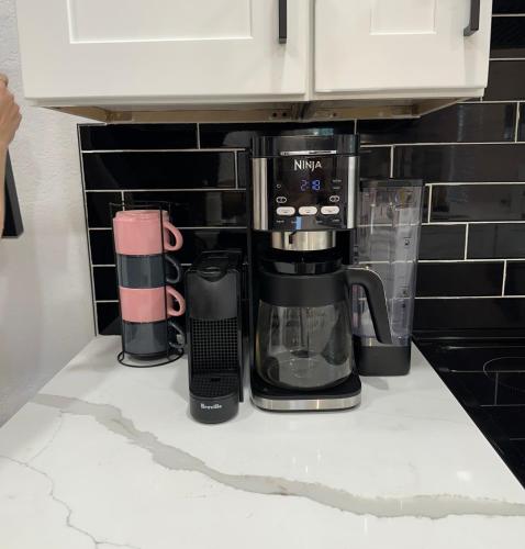 a coffee maker on a counter in a kitchen at 4BR Modern Getaway by Lackland & SeaWorld in San Antonio