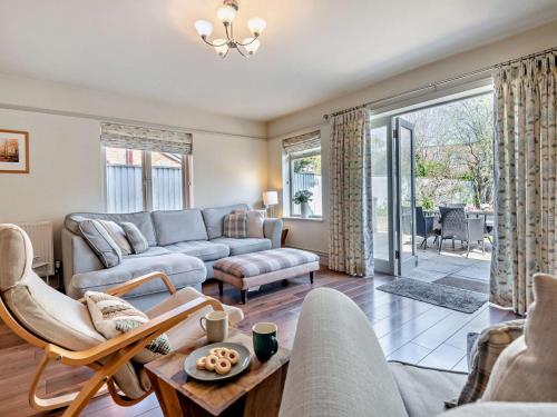 a living room with a couch and a table at 3 Bed in Brockenhurst NFL92 in Brockenhurst