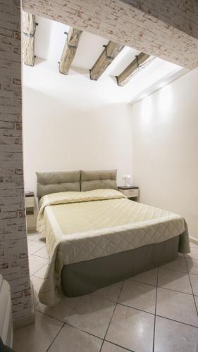 Postel nebo postele na pokoji v ubytování Hotel la Fenice