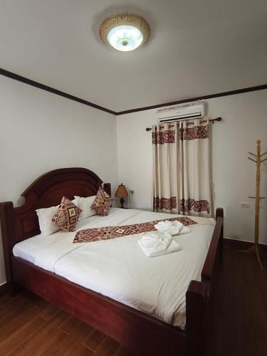 Ένα ή περισσότερα κρεβάτια σε δωμάτιο στο Ananta Hotel Luangprabang