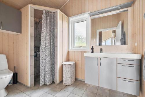 a bathroom with a toilet and a sink and a shower at 20409-Samso-Nylandsvej-21-A in Ballen
