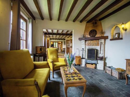 a living room with a couch and a fireplace at Holiday Home in Alveringem near Coast in Leisele