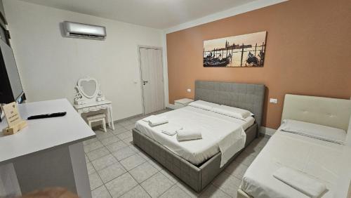 Postel nebo postele na pokoji v ubytování Venice Apartments