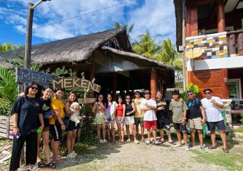 a group of people standing in front of a building at Mekeni transient house and restaurant in Pagudpud