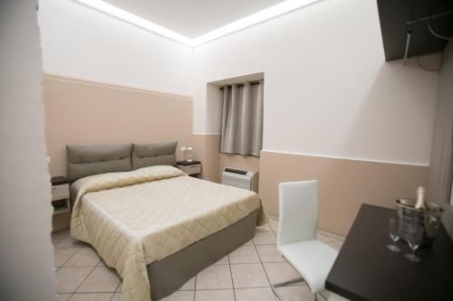 Postel nebo postele na pokoji v ubytování Hotel la Fenice
