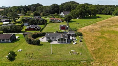 an aerial view of a house on a grass field at AE301-Aeroskobing-Skraningen-12 in Ærøskøbing