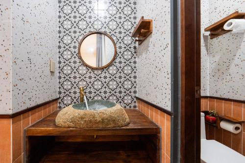 a bathroom with a sink and a mirror at Lumiere Family Village Long Khánh - Đồi Rìu in Long Khanh