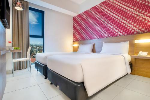 favehotel Malioboro - Yogyakartaにあるベッド