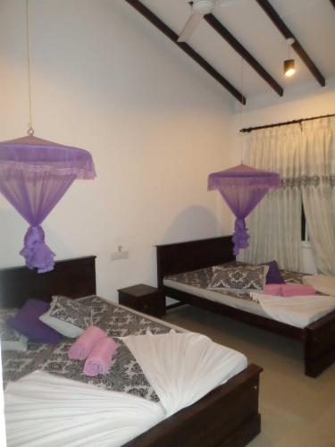 Cama o camas de una habitación en Romana Rest Kataragama