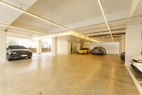 a large garage with two cars parked in it at Hotel Onna Haeundae in Busan