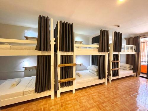 a group of bunk beds in a room at Chill Out Hostel in Boracay