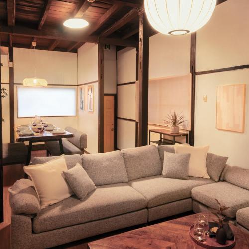 a living room with a couch and a table at Close to Shinjuku! 3BR House for 10, Kids Welcome, High-Speed Wi-Fi in Tokyo