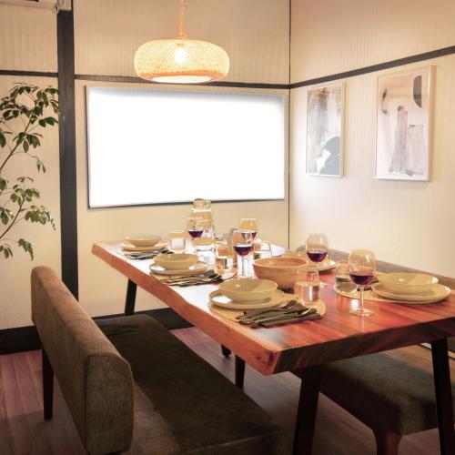 a dining room table with glasses of wine on it at Close to Shinjuku! 3BR House for 10, Kids Welcome, High-Speed Wi-Fi in Tokyo
