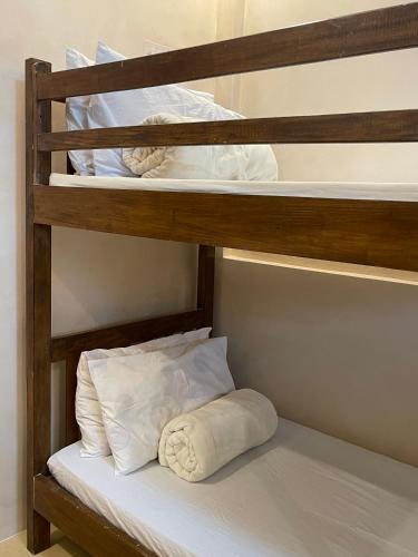 a bunk bed with a pillow on the bottom bunk at Pook ni Urduja Resort 
