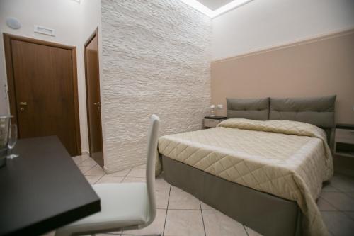 Postel nebo postele na pokoji v ubytování Hotel la Fenice