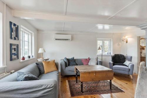 a living room with two couches and a table at AE222-Marstal-Trouslokkevej-1 in Marstal