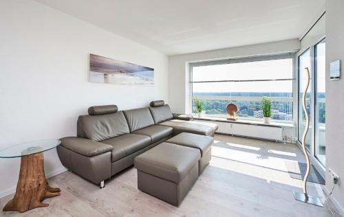 a living room with a couch and a table at Frische Brise - 1504 in Cuxhaven