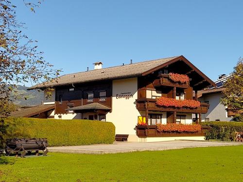 a large building with flowers on the front of it at Appartementhaus Ederegger in Ebbs