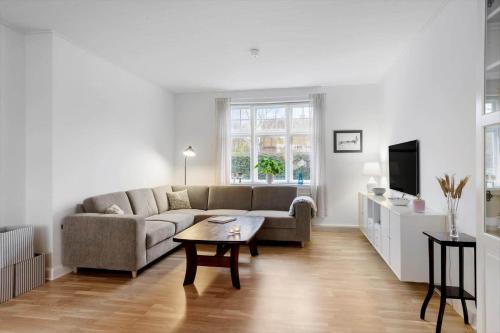 a living room with a couch and a table at AE303-Aeroskobing-Sygehusvejen-3 in Ærøskøbing