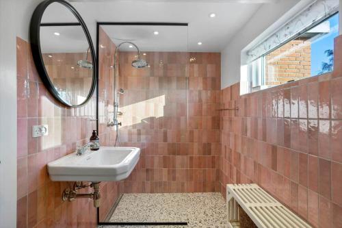 a bathroom with a sink and a mirror at AE287-Marstal-Kirkevejen-38 in Marstal