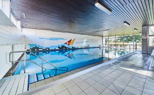 a large swimming pool in a building at Frische Brise - 2.11 in Cuxhaven