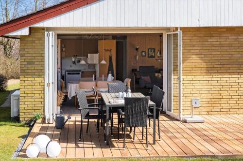a patio with a table and chairs on a deck at SB50374-Aabenraa-Kloften-35 in Aabenraa