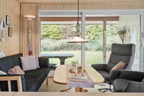 a living room with a couch and a table at SB50374-Aabenraa-Kloften-35 in Aabenraa