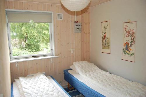 a bedroom with two beds and a window at SB50374-Aabenraa-Kloften-35 in Aabenraa