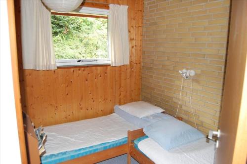 a small room with two beds and a window at SB50374-Aabenraa-Kloften-35 in Aabenraa