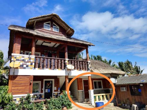 a house with a large mirror in front of it at Mekeni transient house and restaurant in Pagudpud