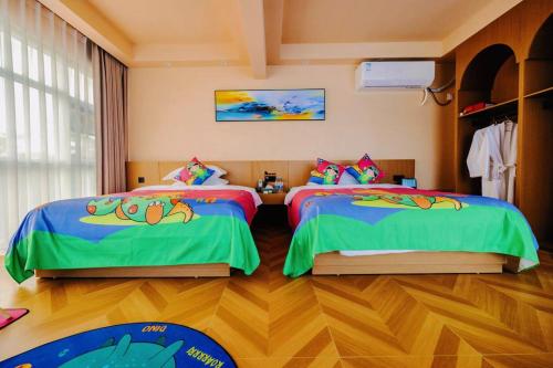 a bedroom with two beds with cartoons on them at Langying Intelligent Guesthouse in Changshancun