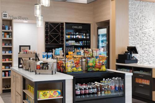 a store with a counter with food and drinks at Hilton Garden Inn Austin Central in Austin