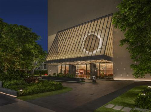 a large building with a lot of windows at Kromo Bangkok, Curio Collection By Hilton in Bangkok