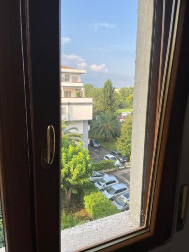a window with a view of a parking lot at Manuel House in Pisa in Pisa