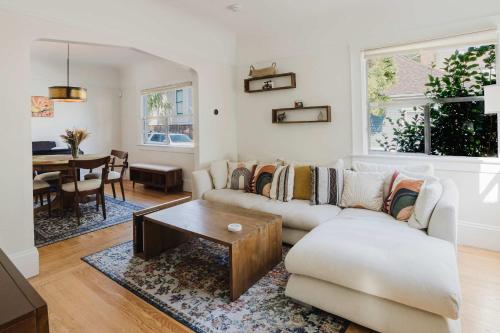 a living room with a couch and a table at Allura Oakland Your Private Sanctuary in the City in Oakland